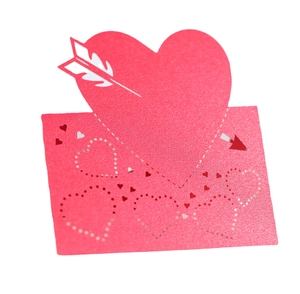 Pink laser-cut heart table card with arrow and hollow pattern for wedding decor