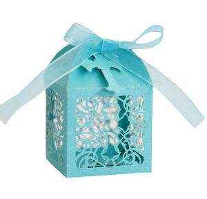 Elegant light blue laser-cut candy box with cross patterns and a matching ribbon bow