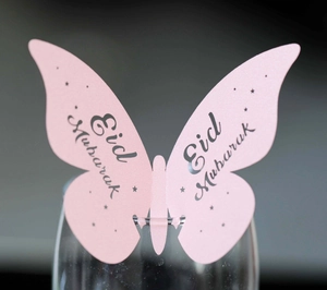 Pink butterfly glass card with Eid Mubarak gold text and glitter pearlescent texture