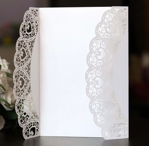 Elegant white laser cut wedding invitation card with heart lace hollowed edges and floral decor