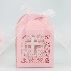 Pink laser-cut cross favor box with pearlescent finish and satin ribbon for weddings