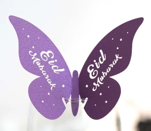 Purple butterfly place card with Eid Mubarak laser cut design for party glassware