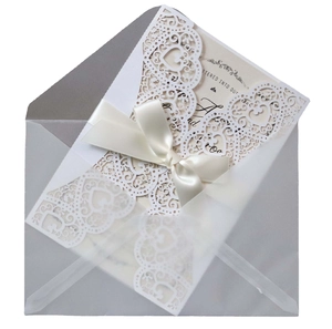 Elegant laser cut heart wedding invitation set with white lace cover and satin bow