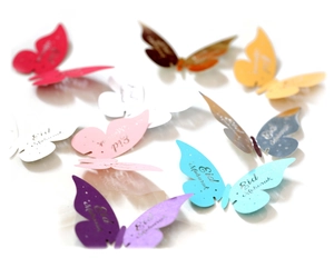 Detail of colorful laser-cut butterfly cup cards with Eid Mubarak festive engraving