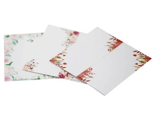 Elegant white floral place cards featuring rose and maple leaf designs for weddings