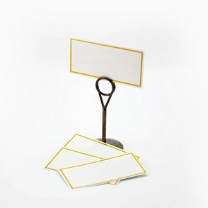Elegant gold foil border place cards with bronze metal holder for wedding table seating