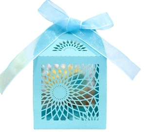 Light blue laser-cut sunflower pattern gift box with matching ribbon bow on white background