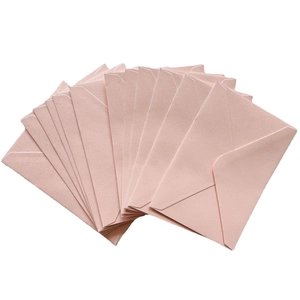 Elegant light pink gummed paper envelopes in a fan-shaped arrangement for invitations