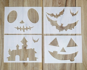 Detail of four Halloween PET stencils featuring pumpkins, bats, and a spooky castle