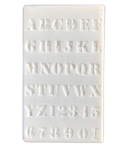 Detail view of transparent PET stencil featuring A-Z letters and 0-9 numbers for DIY projects