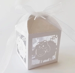Elegant white laser-cut candy box featuring a cartoon sheep design with organza ribbon bow