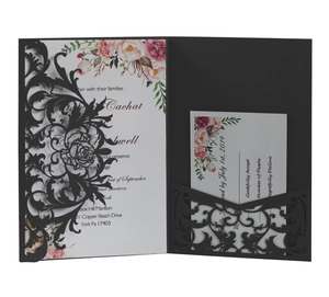 Elegant laser-cut wedding invitation set in black with floral internal cards