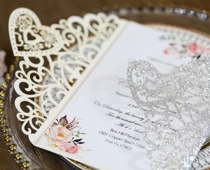 Laser cut hollow wedding invitation with glitter heart detail and floral insert card