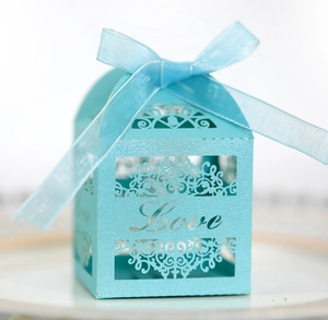 Laser-cut Tiffany blue LOVE favor box with elegant silk ribbon bow for weddings