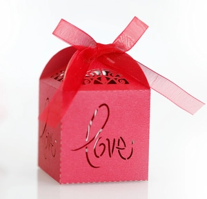 Red hollow-out LOVE candy box with pearlescent finish and red organza ribbon bow