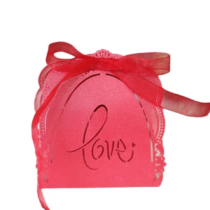 Red laser-cut Love wedding candy box with delicate lace hollow pattern and ribbon bow