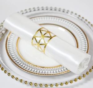 Modern gold hollow geometric napkin ring with honeycomb pattern for elegant table decor
