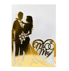 Elegant gold mirror Mr & Mrs wedding silhouette cake topper with hollow heart design