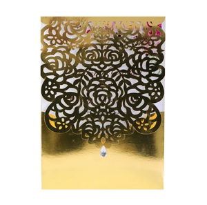 Elegant gold laser cut rose wedding invitation with pearl paper and crystal detail