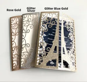 Detail showing laser-cut Eiffel Tower wedding invitations in rose gold and glitter silver