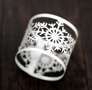 Elegant laser-cut white snowflake napkin rings for Christmas and wedding table settings