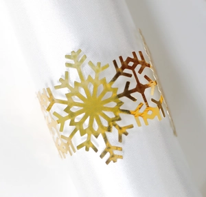 Elegant golden snowflake napkin ring with hollow laser-cut design for Christmas table decor