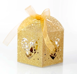 Glitter gold laser cut LOVE heart wedding favor box with a silk ribbon bow and sparkly finish