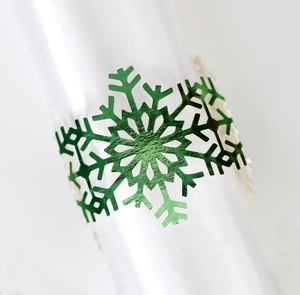 Green metal snowflake napkin ring holder for festive Christmas dining table decor