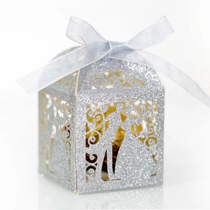 Silver glitter laser cut wedding favor box with romantic bride and groom silhouette