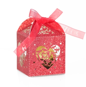 Laser cut red glitter LOVE heart wedding favor box with a silk ribbon bow and hollow design
