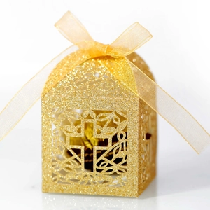 Golden glitter laser cut cross candy box with ribbon and vine patterns for favors