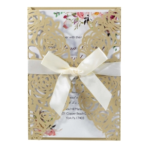 Elegant gold hollow laser cut rose wedding invitation with a cream ribbon and flower inner page