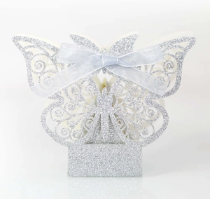 Elegant laser-cut butterfly wedding favor box with silver glitter and blue satin ribbon bow