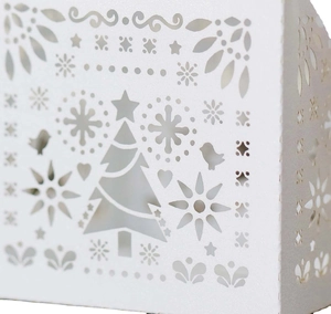 White laser-cut Christmas favor box with hollowed snowflake and tree patterns for candies