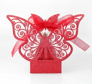 Red glitter laser-cut butterfly wedding favor box with elegant silk ribbon bow