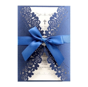 Navy blue laser cut wedding invitation with rose hollow design and blue satin ribbon bow