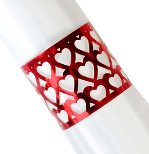 Laser-cut red metallic heart napkin ring wrap on white satin for wedding table