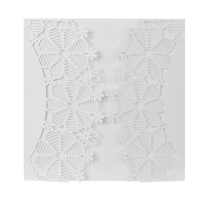 Laser-cut white wedding invitation card with intricate floral lace and mesh patterns
