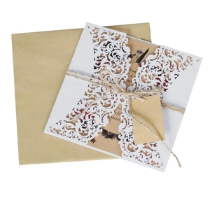 Elegant laser cut white lace wedding invitation set with kraft paper card and hemp rope