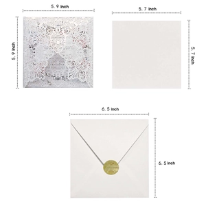Laser cut floral wedding invitation set with white envelopes and sizing details