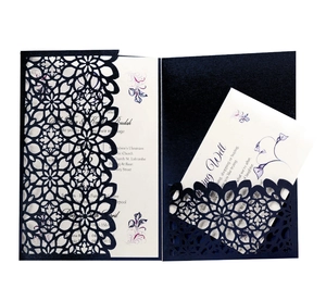 Elegant navy blue laser-cut wedding invitation set with floral hollowed-out sleeve
