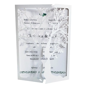 Laser-cut white paper wedding invitation with tree of life and heart design on white base