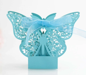 Elegant light blue laser-cut butterfly wedding favor box with a delicate ribbon bow