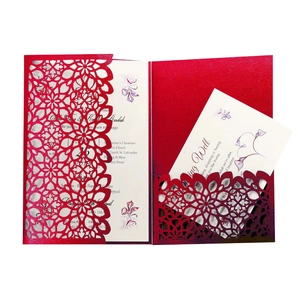 Elegant red laser-cut wedding invitation pocket with floral patterns and cream inner card