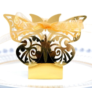 Golden butterfly laser-cut wedding candy box with a shimmering gold organza ribbon