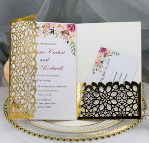 Navy laser-cut pocket wedding invitation set with floral insert card and gold accents