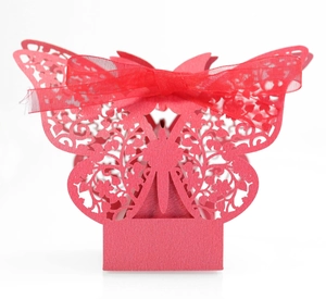 Vibrant red laser-cut butterfly wedding favor box with an elegant silk ribbon bow