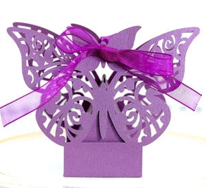 Elegant purple butterfly hollow candy box with laser-cut patterns and satin ribbon bow