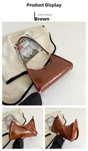 Vues détaillées du sac baguette en cuir marron brillant avec fermeture éclair et bandoulière