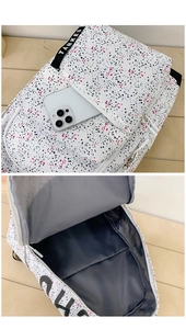 Detail showing the inner waterproof lining and exterior zip pocket of this dotted backpack